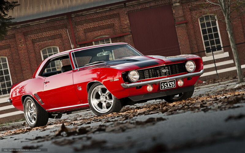 Red Classic Muscle Car — Dramatic, Autumn, Photograph, Brick Building, Fallen Leaves