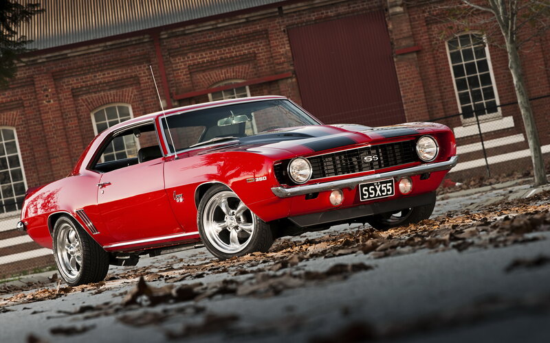 Red Classic Muscle Car — Dramatic, Autumn, Photograph, Brick Building