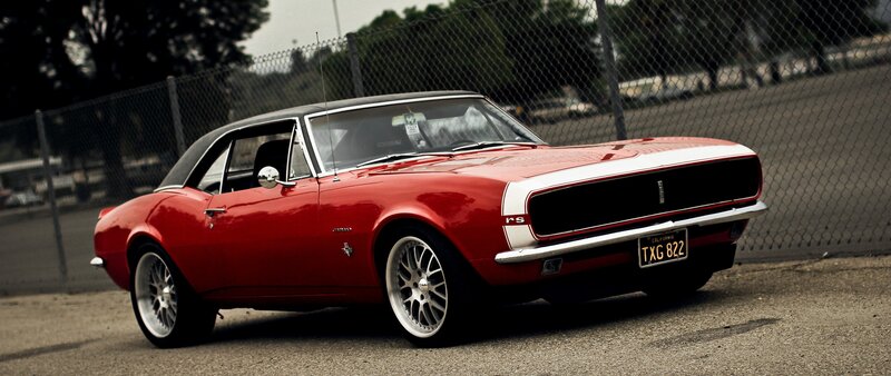Red Classic Muscle Car — Dramatic, Photograph, Fence, Trees
