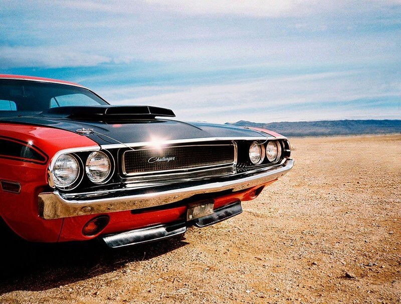 Red classic muscle car in desert