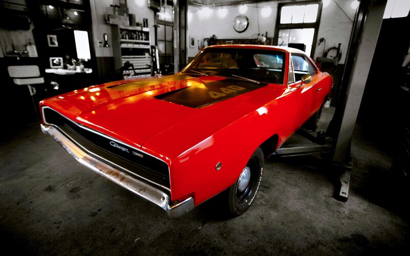 Red classic muscle car in garage