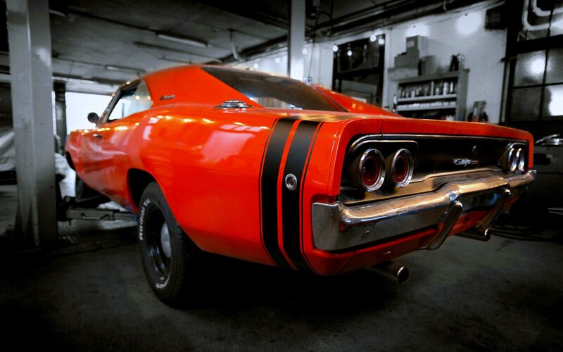 Red classic muscle car in garage