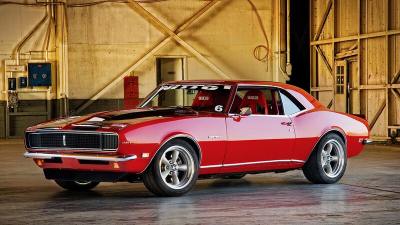 Red classic muscle car in garage