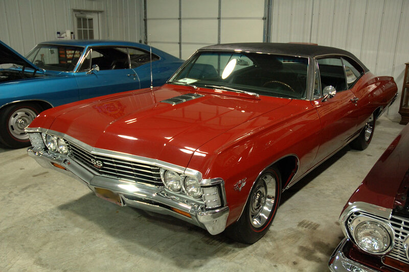 Red classic muscle car in garage