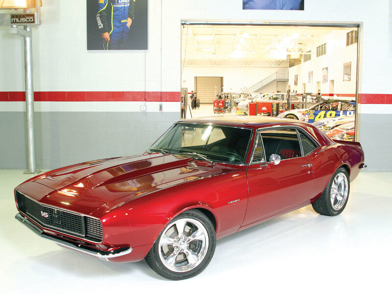 Red classic muscle car in garage