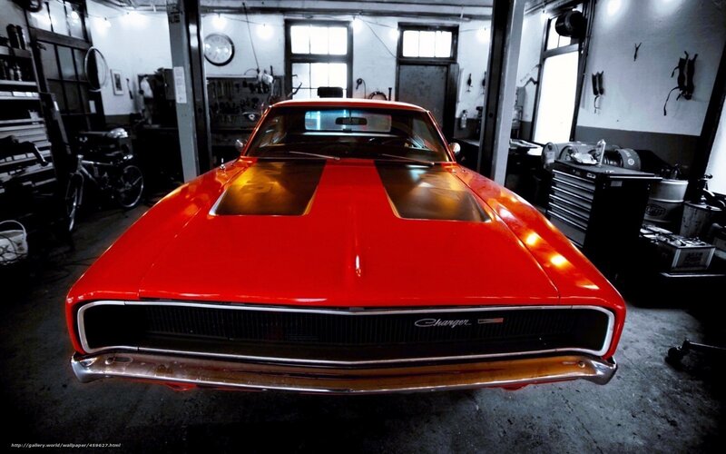 Red classic muscle car in garage