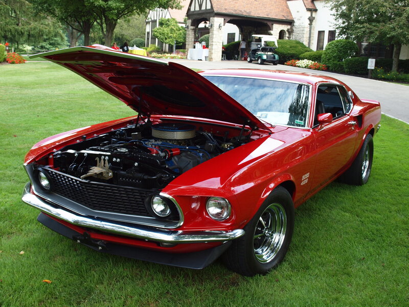 Red classic muscle car on display