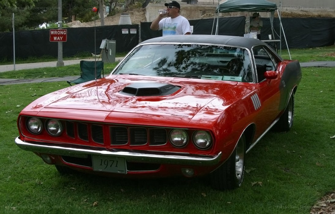 Red classic muscle car on display