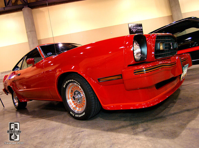 Red classic muscle car on display