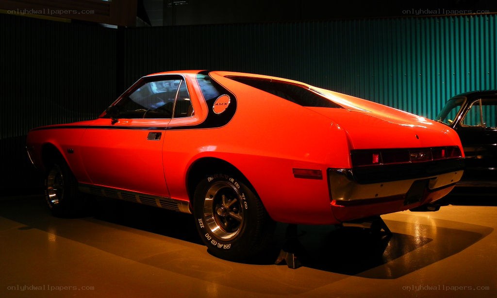 Red classic muscle car on display