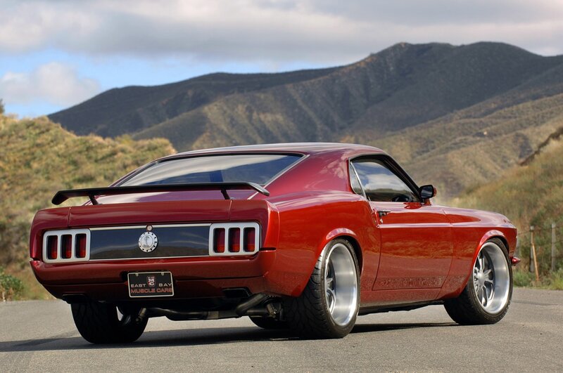 Red classic muscle car on road