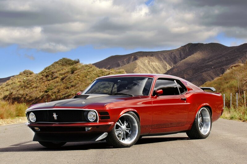 Red classic muscle car on road