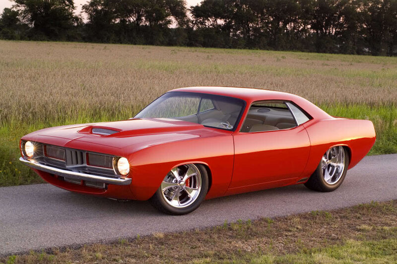 Red classic muscle car on road