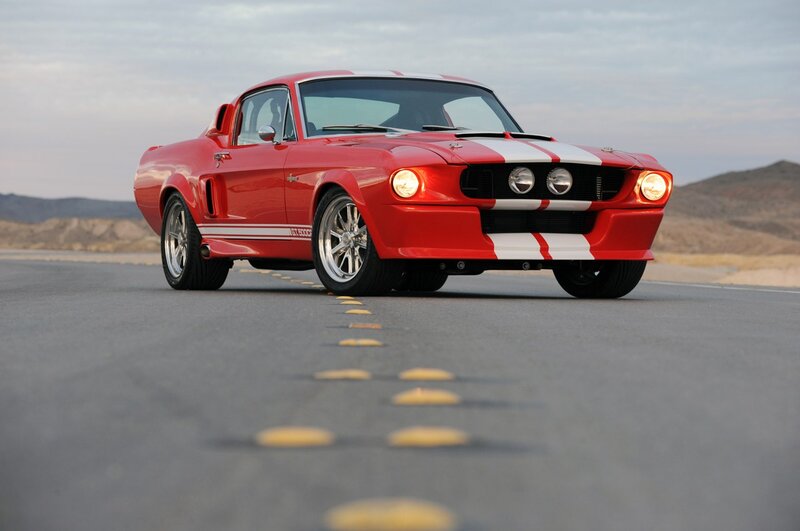 Red classic muscle car on road