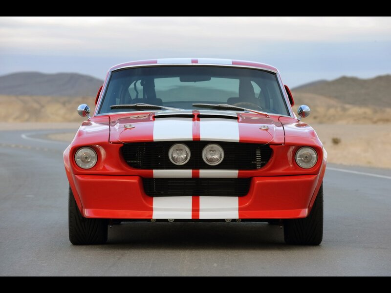Red classic muscle car on road