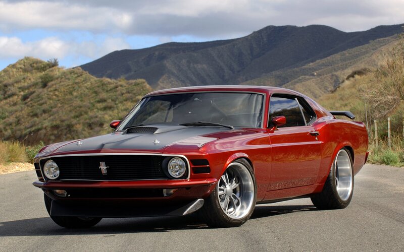 Red classic muscle car on road