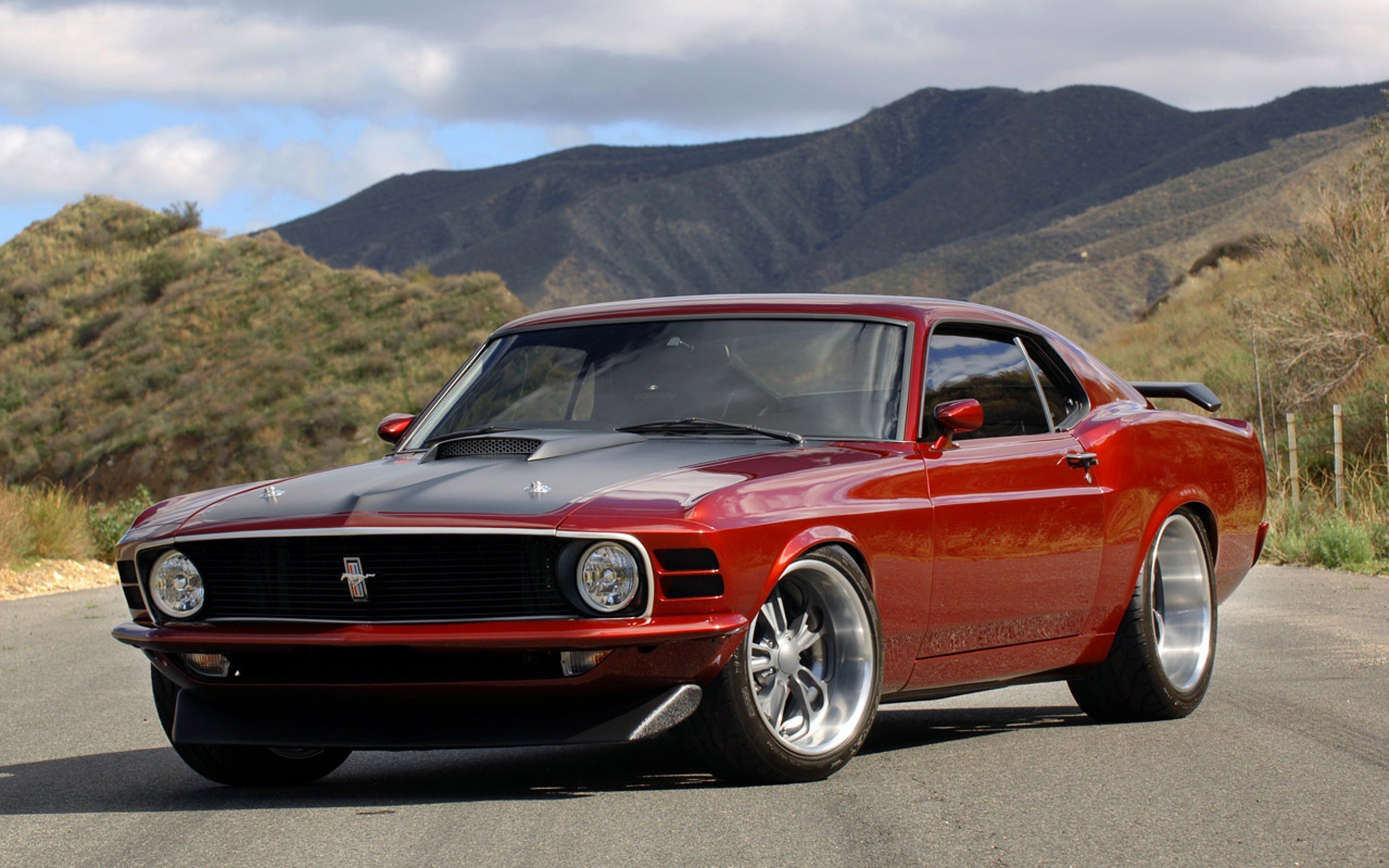 Red classic muscle car on road