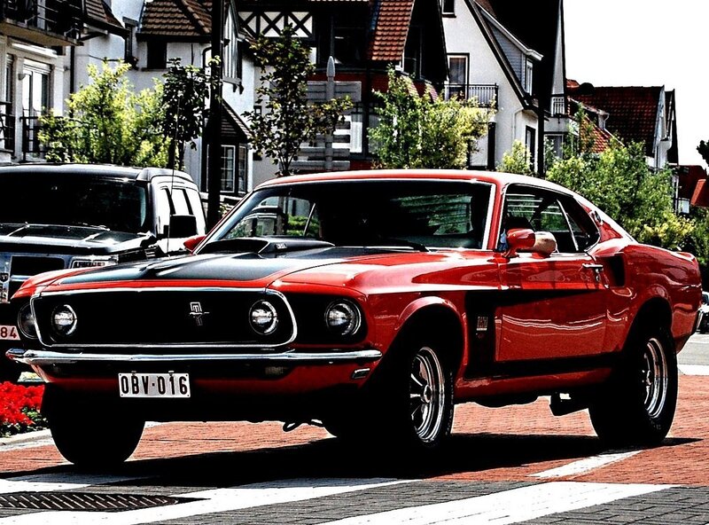 Red classic muscle car on street