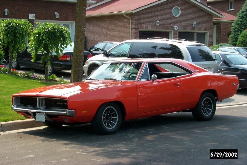 Red classic muscle car on street