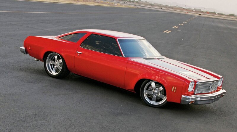 Red classic muscle car on tarmac