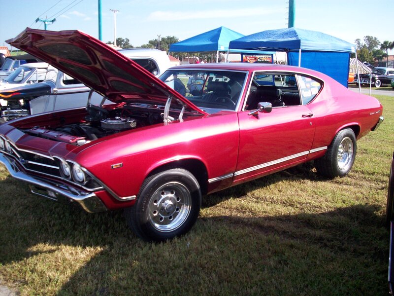 Red Classic Muscle Car — Outdoor, Afternoon, Photograph, Car Show, Grass Field, Blue Tent