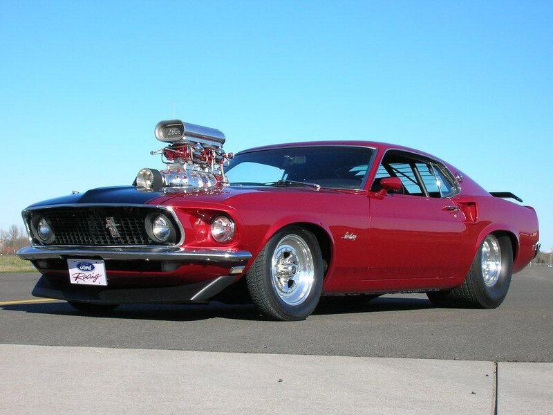 Red classic muscle car with supercharger