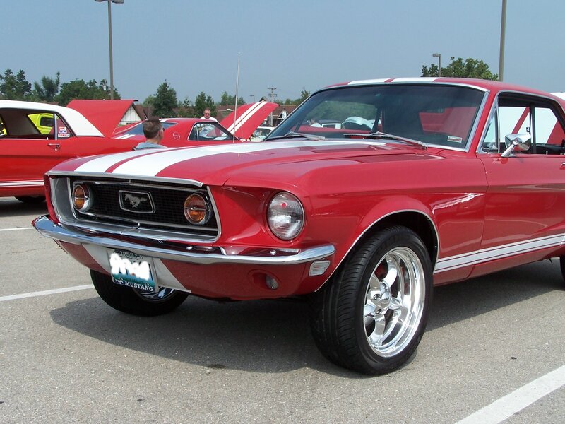 Red classic Mustang at car show