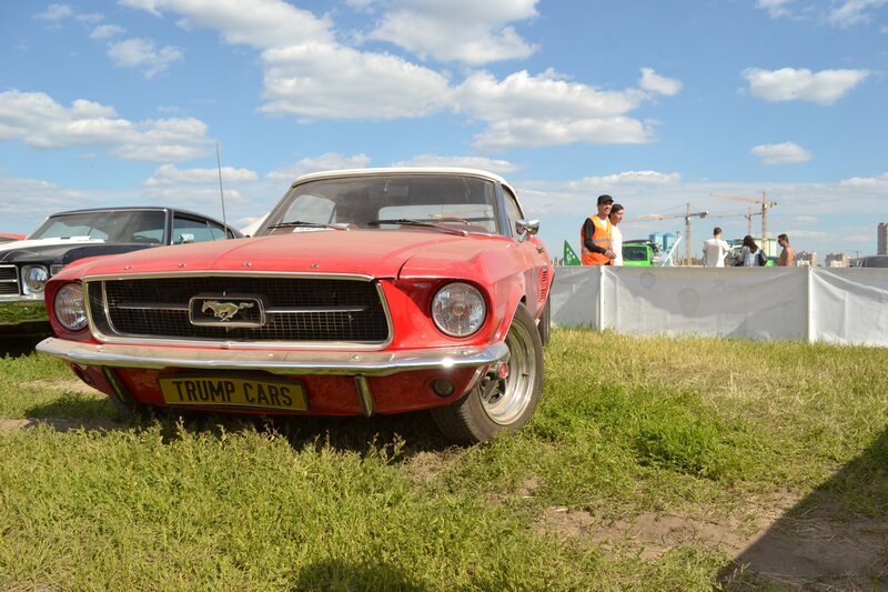 Red classic Mustang at outdoor show