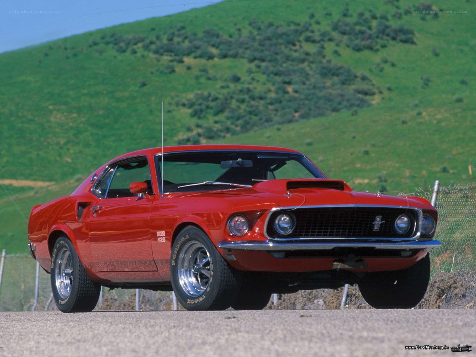 Red classic Mustang on a hillside
