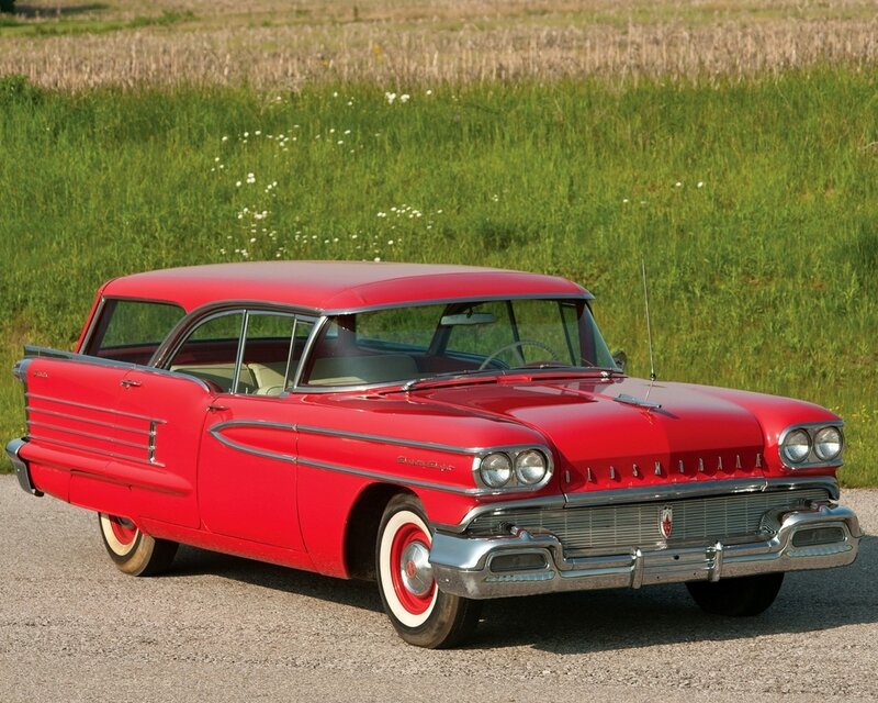 Red classic Oldsmobile station wagon