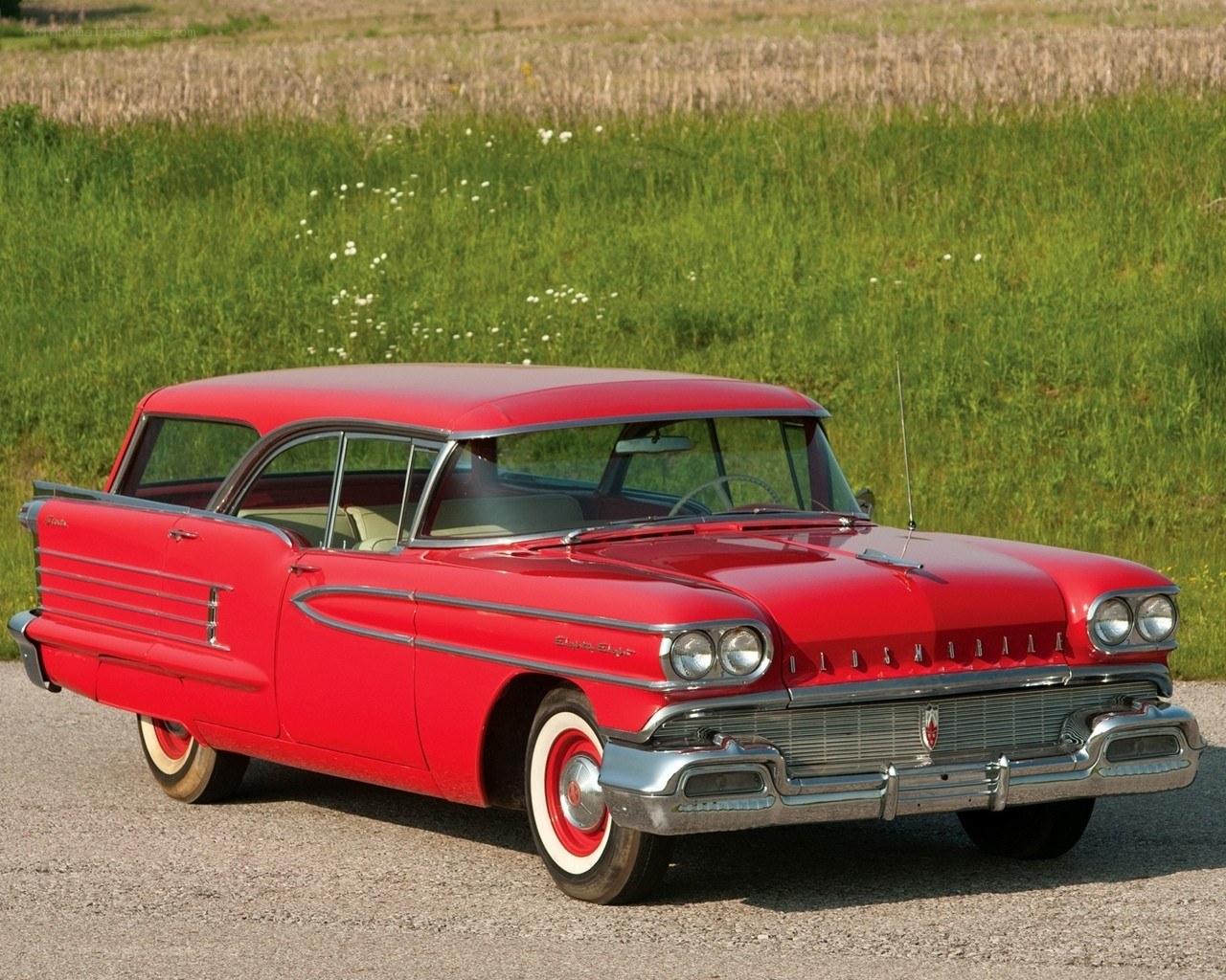Red classic Oldsmobile station wagon