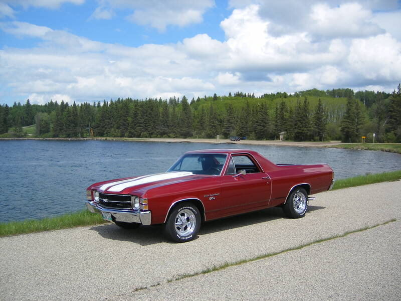 Red classic pickup by the lake
