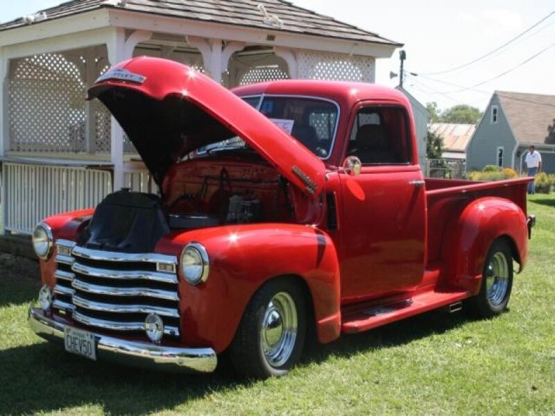 Red classic pickup truck on display