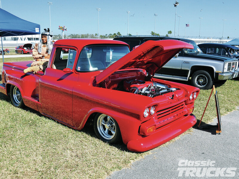 Red Classic Pickup Truck — Outdoor, Afternoon, Photograph, Person in Costume