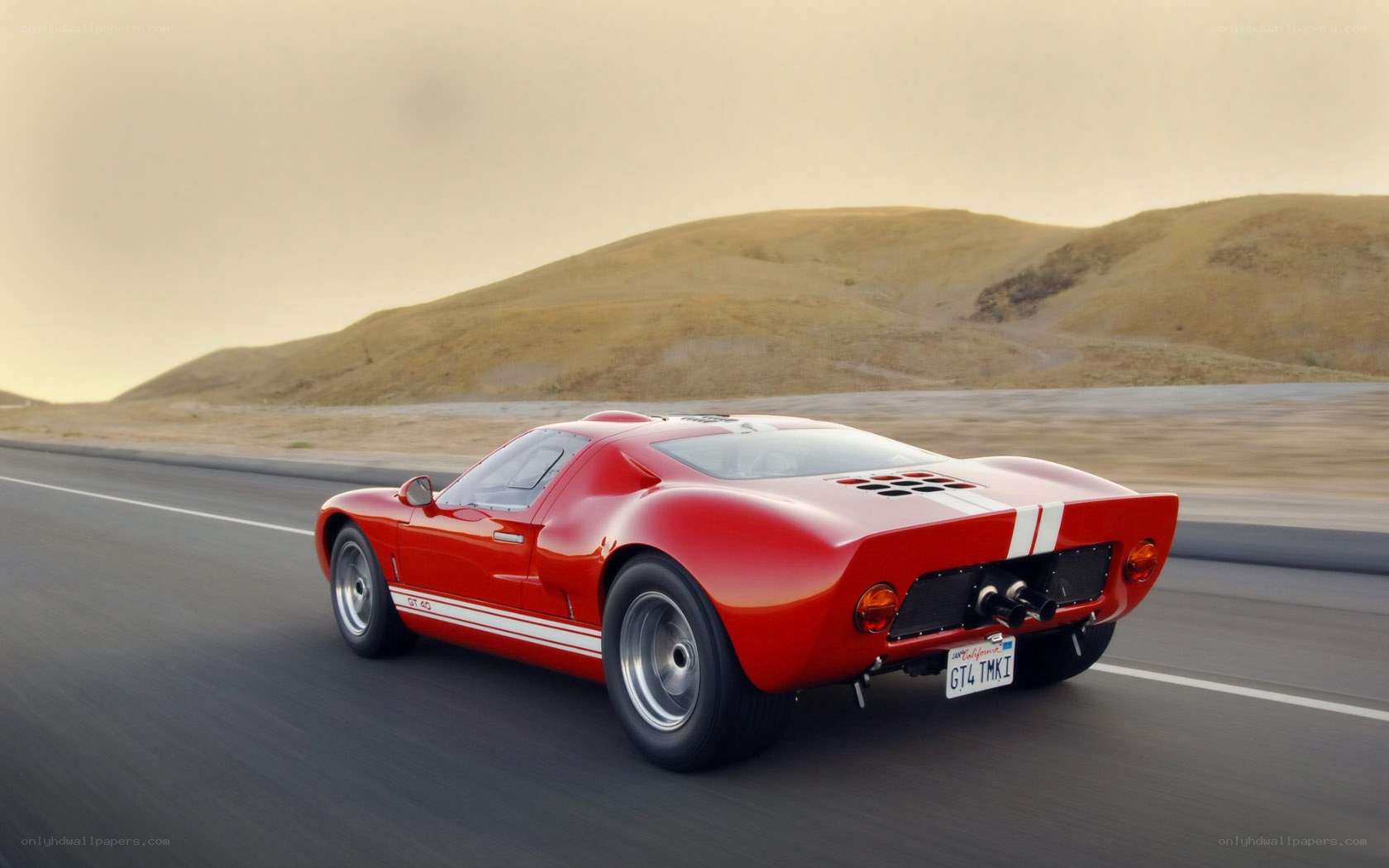 Red classic race car on road