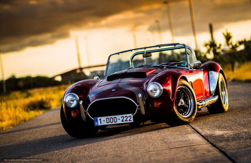 Red classic sports car on road