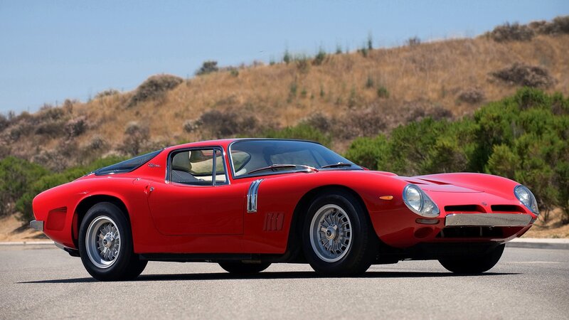 Red classic sports car on road