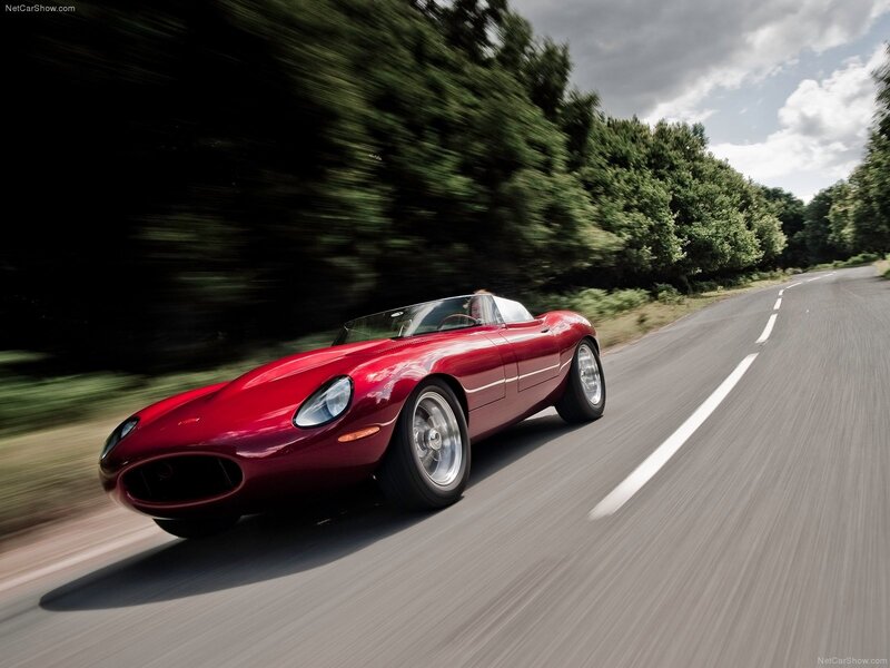 red classic sports car on road