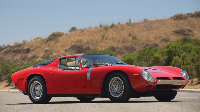 Red classic sports car on road