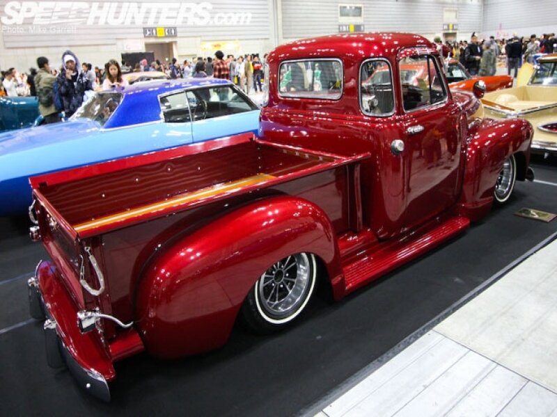 Red classic truck at car show