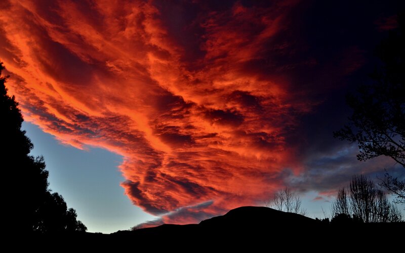 Red Clouds over Hills