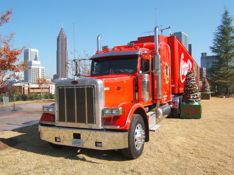 Red Coca-Cola truck in city