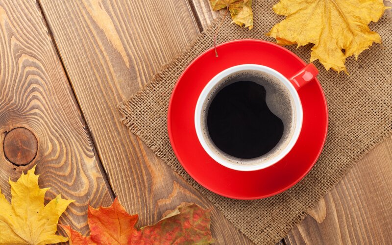 Red Coffee Cup on Wood