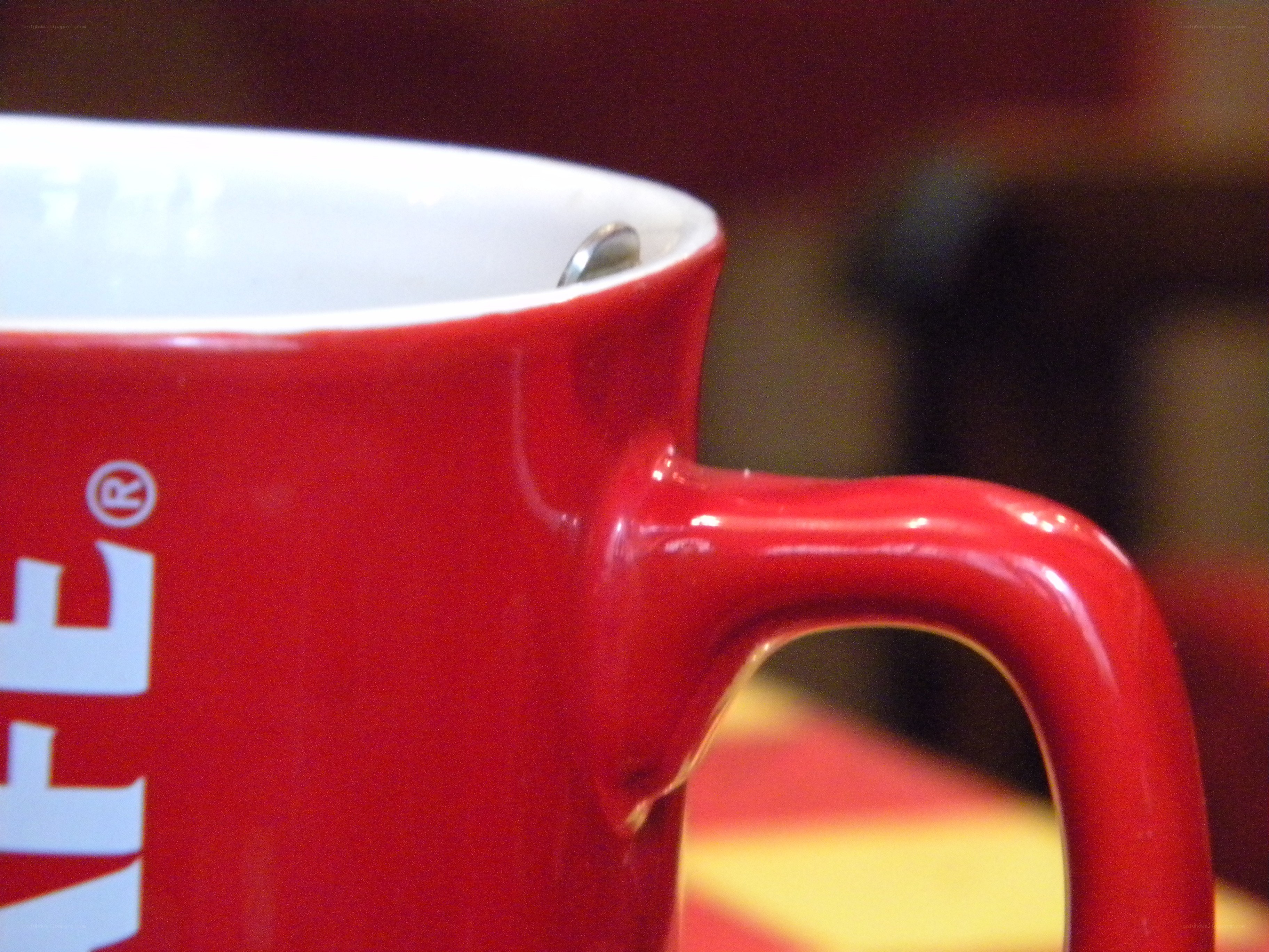 red coffee mug with spoon