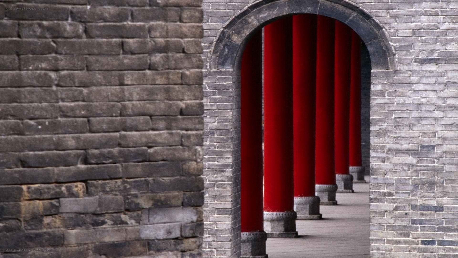 Red columns through archway