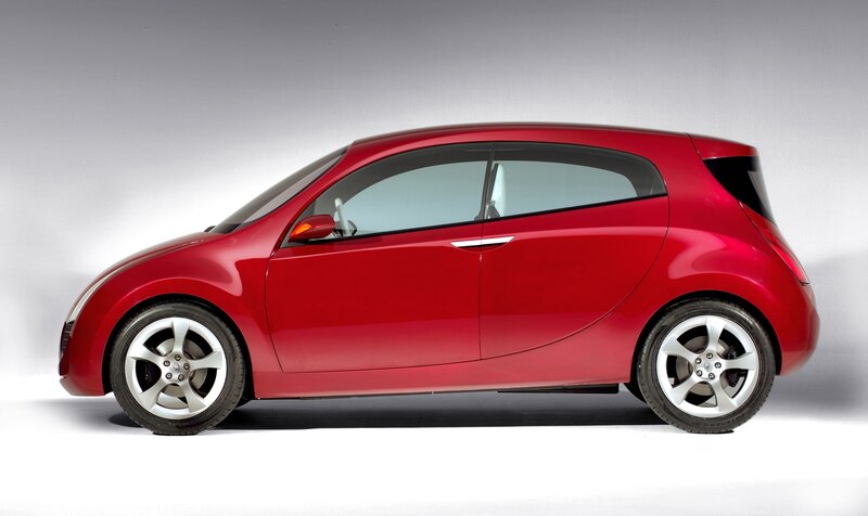 red compact car side view