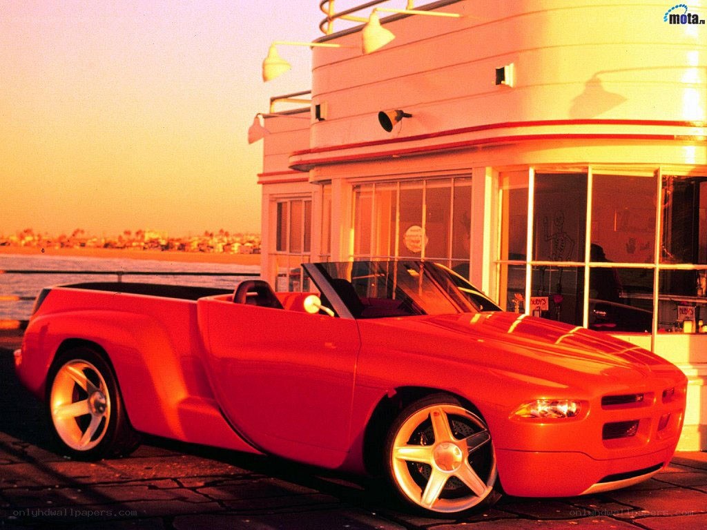 Red concept car at sunset
