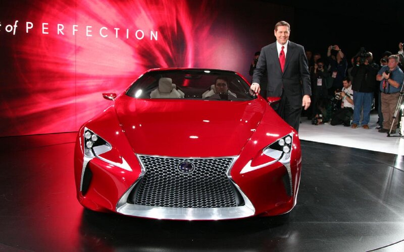 Red Concept Car — Dramatic, Photograph, Man in Suit