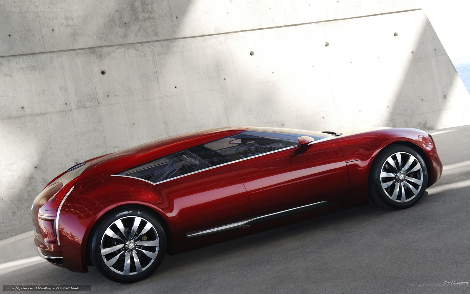 Red concept car in concrete setting