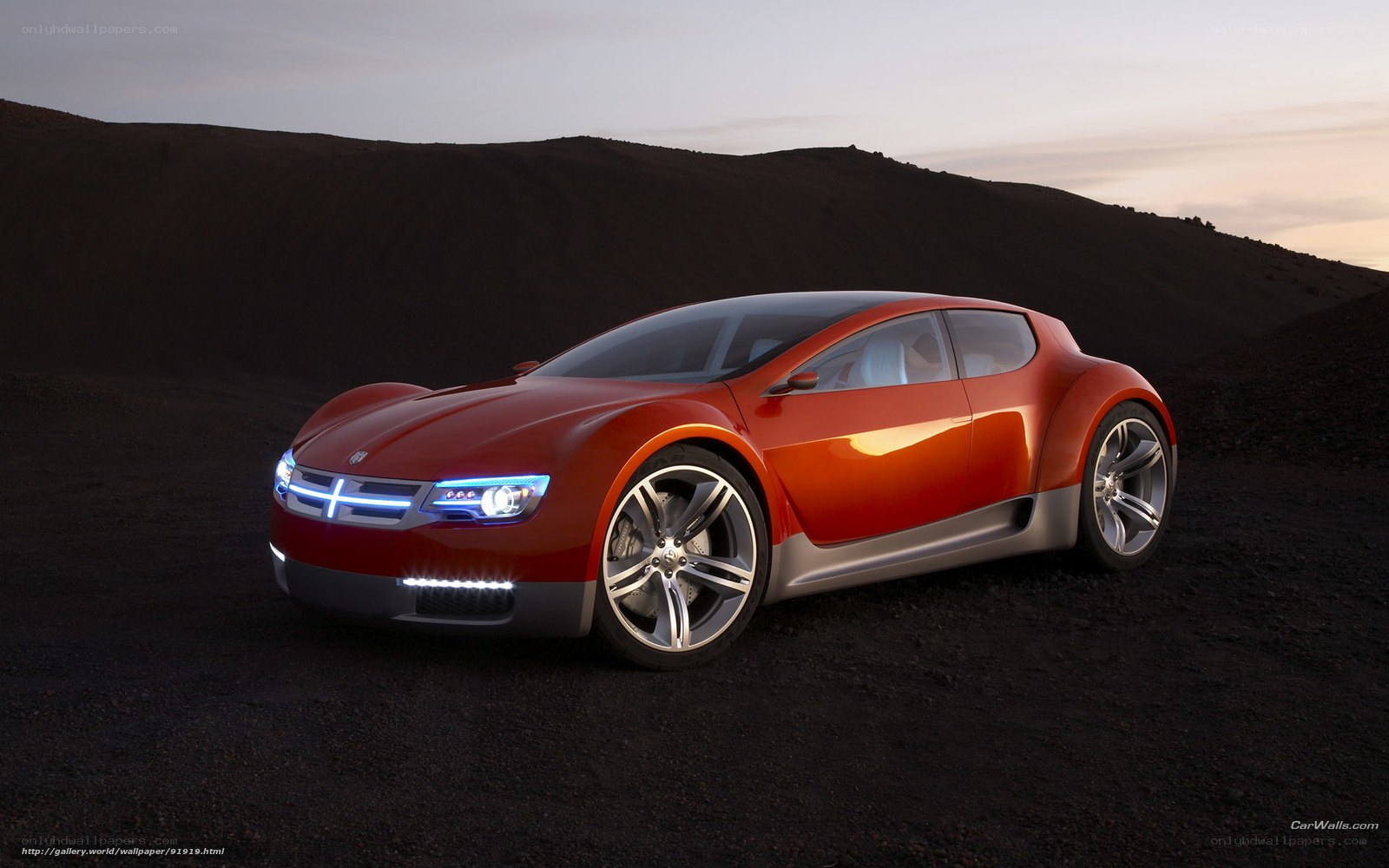 Red concept car on dark terrain